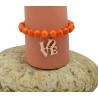 Bracelet orange en perles Millénium avec charm Love – Lucky Team